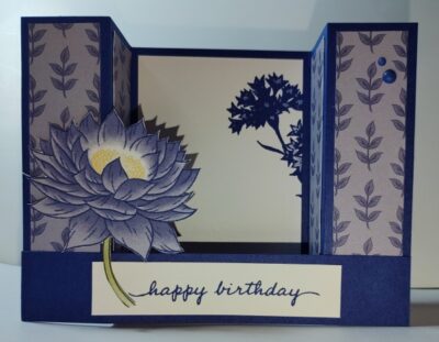 a bridge fold card made with cut up DSP & flower hand cut