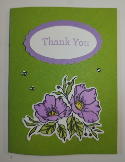 Teabag favor in a card with flowers on the front