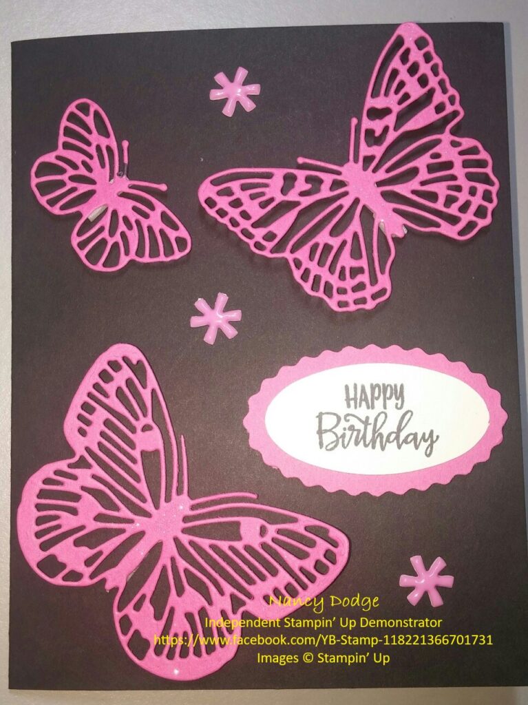 a handmade card with pink butterflies on black cardstock saying "happy birthday"