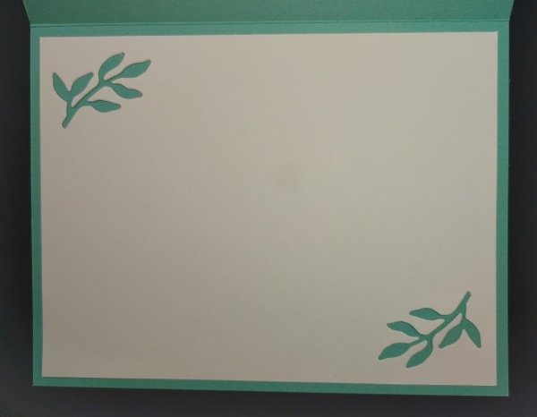 inside of card is blank with leaf branches die-cut from cardstock