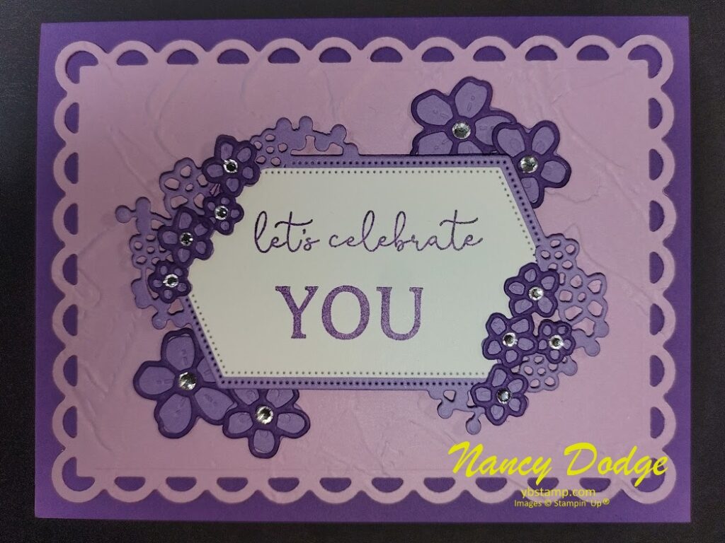 a Mother's Day card in 3 shades of purple with many flowers saying "Let's celebrate you"