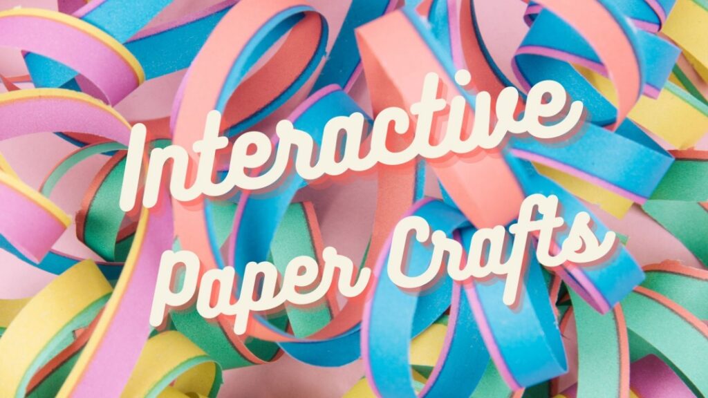 colorful curled strips of paper with "interactive paper crafts" written on it