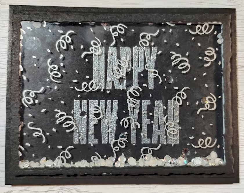 Black card front with silver sentiment saying Happy New Year