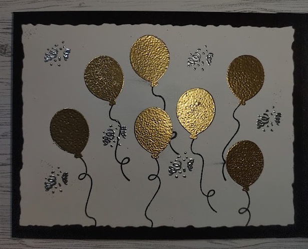 Gold balloons and silver streamers embossed on white cardstock